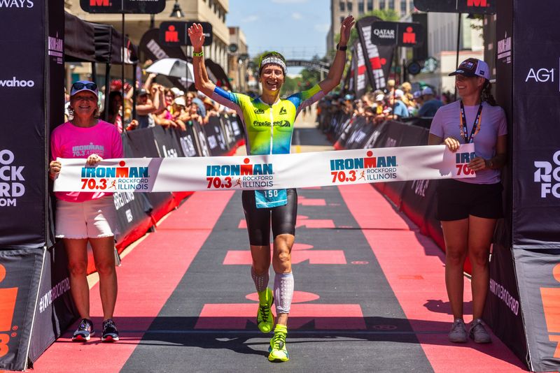Jana Richtrova celebrates crossing the finish line and taking first place in the women’s division of IRONMAN 70.3 Rockford on Sunday, June 22, 2025, in downtown Rockford.
