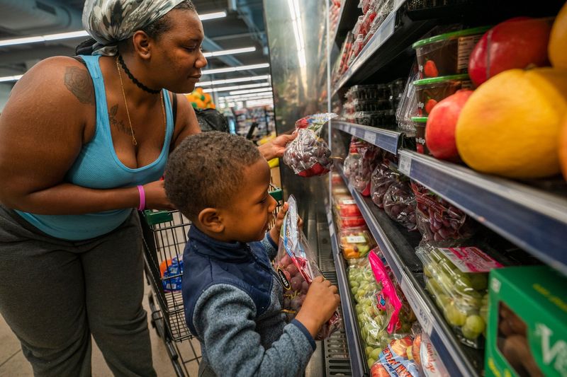 Tyshane Taylor, 26, of Detroit, left, shops with her son Ma Khai Taylor, 3, at the Detroit People's Food Co-op, a community owned grocery store and event space photographed on Friday, May 2, 2025 as it celebrates its one year anniversary.
