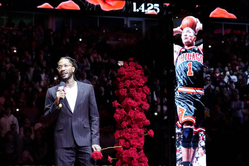 Former Chicago Bulls player Derrick Rose speaks as he is honored at halftime of a game between the Bulls and the New York Knicks at United Center.