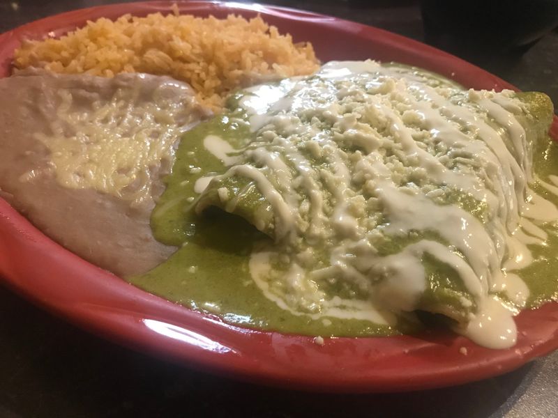 Chicken enchiladas with beans and rice is an entree served October 18, 2023, at Mexico Clasico in Rockford.