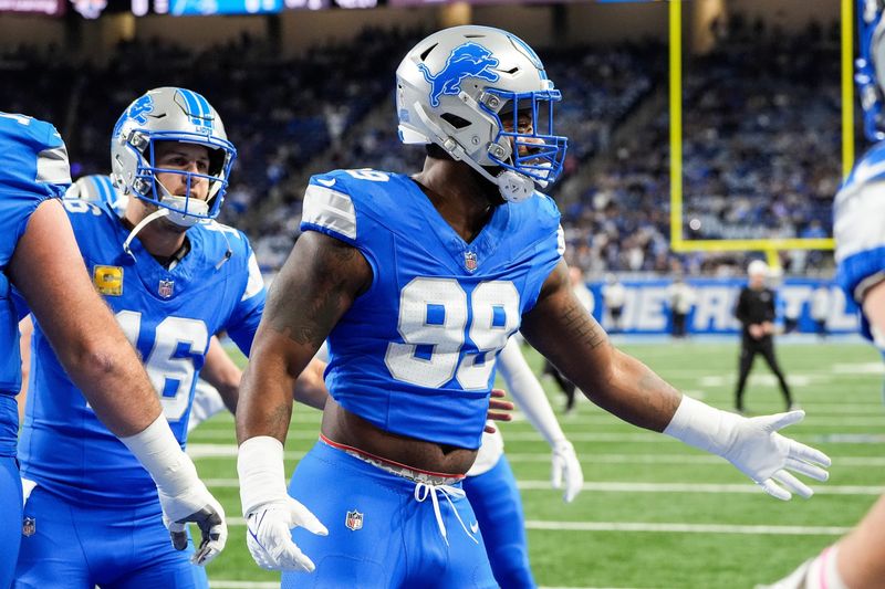 Detroit Lions defensive end Za'Darius Smith (99) high-fives teammates during warmups before the game vs. the Jacksonville Jaguars at Ford Field in Detroit on Sunday, Nov. 17, 2024.