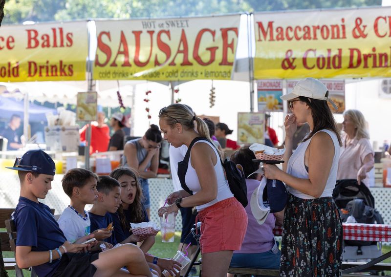People enjoy the variety of food available in the food area on Opening Day of the 2025 Monmouth County Fair in Freehold, NJ on July 23, 2025.
