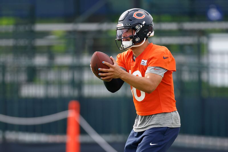 Jul 24, 2025; Lake Forest, IL, USA; Chicago Bears quarterback Caleb Williams (18) looks to pass the ball during training camp at Halas Hall. Mandatory Credit: Kamil Krzaczynski-Imagn Images