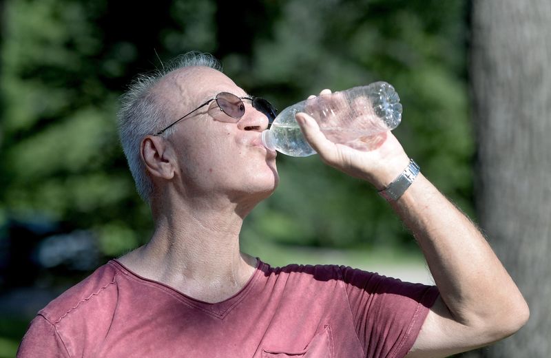 Dennis Jones of Springfield cools down while doing his exercise walk at Washington Park on July 23, 2025, in Springfield. Heat index values were expected to rise to 110-115 degrees on July 23 and July 24 during a heat wave.