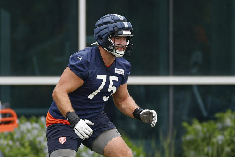 Jun 3, 2025; Lake Forest, IL, USA; Chicago Bears offensive tackle Ozzy Trapilo (75) warms up during minicamp at Halas Hall. Mandatory Credit: Kamil Krzaczynski-Imagn Images