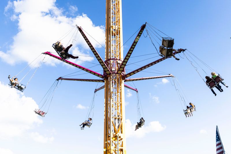 People ride carnival rides Aug. 13, 2025, during the Winnebago County Fair in Pecatonica.