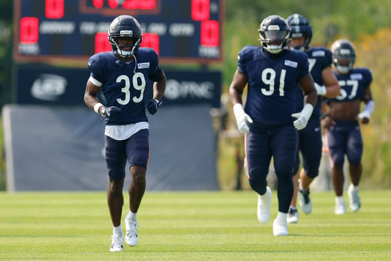 Aug 15, 2025; Lake Forest, IL, USA; Chicago Bears cornerback Josh Blackwell (39) warms up with teammates during joint training camp practice with the Buffalo Bills ahead of Sunday's preseason game. Mandatory Credit: Kamil Krzaczynski-Imagn Images