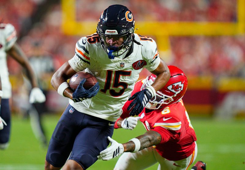 Aug 22, 2025; Kansas City, Missouri, USA; Chicago Bears wide receiver Rome Odunze (15) runs with the ball against Kansas City Chiefs safety Bryan Cook (6) during the first half at GEHA Field at Arrowhead Stadium. Mandatory Credit: Jay Biggerstaff-Imagn Images