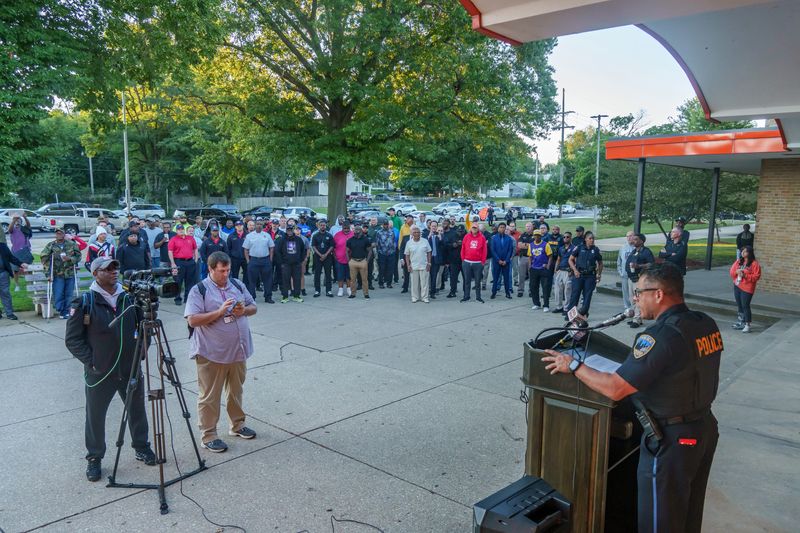 Peoria Police Chief Eric Echevarria speaks to a large crowd of men gathered in front of Manual High School in a show of support Monday, Aug. 25, 2025 in Peoria.