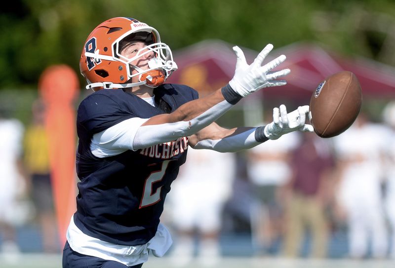 Rochester's Tristan Stanton reaches out for a pass during the game against Gibson Southern Saturday, August 30, 2025.