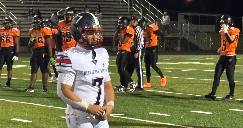 Belvidere North quarterback Andrew Bucci (7) comes over to the sideline to get a play call from coach Jeff Beck in North's 21-0 victory over Freeport at Freeport High School on Sept. 5, 2025.