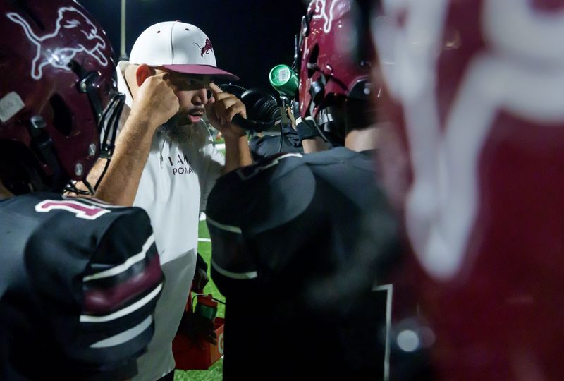 Peoria High football coach Aaron Montgomery tells his players to use their heads in the second half of their Week 2 high school football game Friday, Sept. 5, 2025 at Peoria Stadium. The Lions defeated the Peoria Notre Dame Irish 58-31.