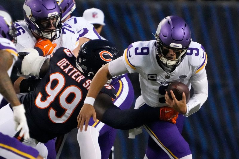 Sep 8, 2025; Chicago, Illinois, USA; Chicago Bears defensive tackle Gervon Dexter Sr. (99) tackles Minnesota Vikings quarterback J.J. McCarthy (9) during the first half at Soldier Field. Mandatory Credit: David Banks-Imagn Images