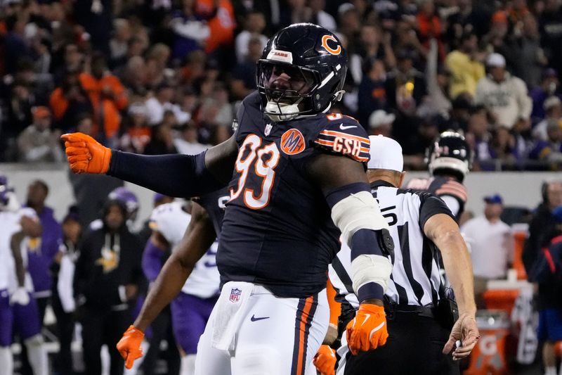 Sep 8, 2025; Chicago, Illinois, USA; Chicago Bears defensive tackle Gervon Dexter Sr. (99) reacts after a sack against the Minnesota Vikings during the second half at Soldier Field. Mandatory Credit: David Banks-Imagn Images