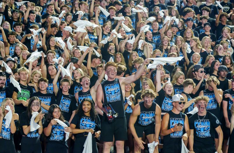 The Pekin student sections gets hyped as the Dragons face the Dunlap Eagles in a high school football game Friday, Sept. 12, 2025 in Pekin. The Dragons fell to the Eagles 28-27 in overtime.