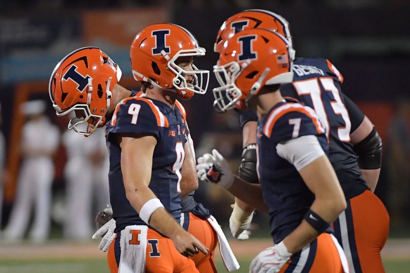 Sep 13, 2025; Champaign, Illinois, USA; Illinois Fighting Illini quarterback Luke Altmyer (9) and teammates after a play during the second half against the Western Michigan Broncos at Memorial Stadium. Mandatory Credit: Ron Johnson-Imagn Images