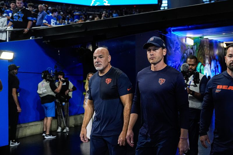 Chicago Bears head coach Ben Johnson walks out of the tunnel to watch warm up at Ford Field in Detroit on Sunday, Sept. 14, 2025.
