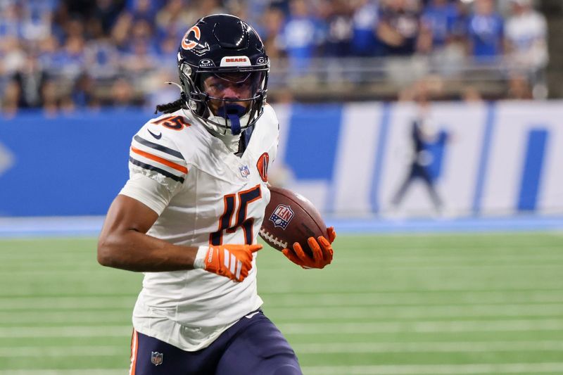 Sep 14, 2025; Detroit, Michigan, USA; Chicago Bears wide receiver Rome Odunze (15) carries the ball for a touchdown against the Detroit Lions during the first quarter at Ford Field. Mandatory Credit: David Reginek-Imagn Images
