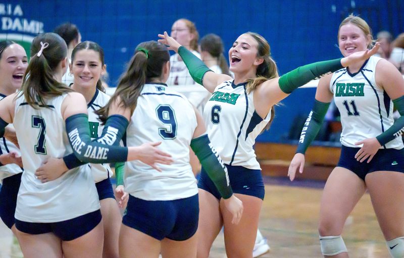 Peoria Notre Dame’s Kate Ament (6) and the Irish celebrate a point against Dunlap during their high school volleyball match Monday, Sept. 15, 2025 at PND High School. The Irish took the match in three sets 25-19, 25-27, 25-19.