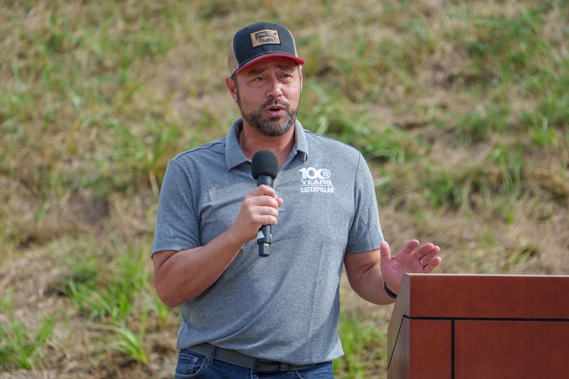 Caterpillar Inc. CEO Joe Creed speaks to the crowd after a demonstration of heavy machinery Friday, Sept. 19, 2025 during Centennial Fest at at the Edwards Demonstration and Learning Center.