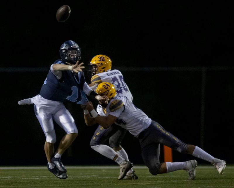 Guilford's Greyson Weber passes the ball against Hononegah on Friday, Sept. 19, 2025, at Guilford High School in Rockford.