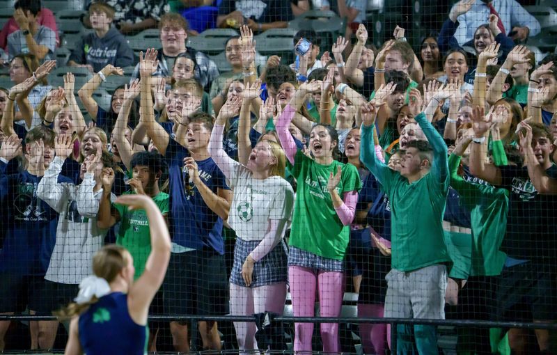 The Peoria Notre Dame student section cheers for the Irish in the first half of their Week 4 high school football game against Richwoods on Friday, Sept. 19, 2025 at Dozer Park in Peoria. The Irish defeated the Knights 42-6.