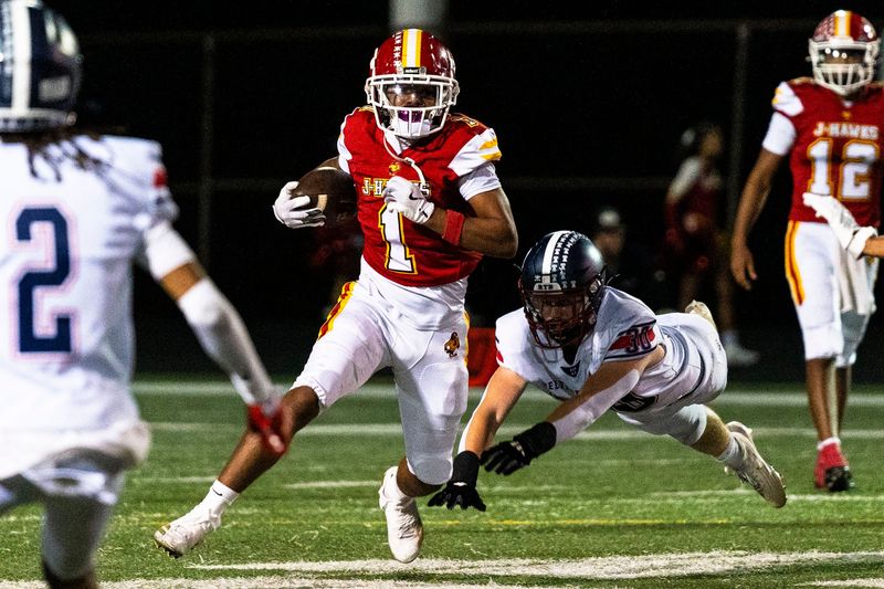 Jefferson’s De'Anglos Roby (1) runs down field during a game against Belvidere North on Sept. 25, 2025, at Guilford High School.