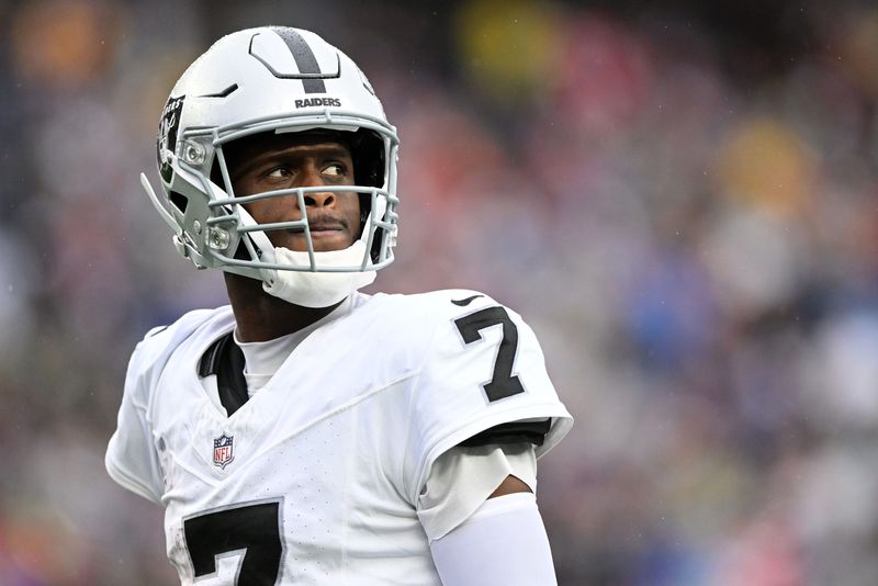 Sep 7, 2025; Foxborough, Massachusetts, USA; Las Vegas Raiders quarterback Geno Smith (7) reacts against the New England Patriots during the second half at Gillette Stadium. Mandatory Credit: Brian Fluharty-Imagn Images