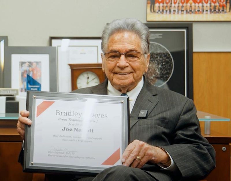 Joe Napoli poses with the "Great Teammate Award" he won from Bradley University in 2023.