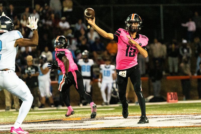 Harlem’s Braxton Fausett (12) passes the ball during a game against Guilford on Sept. 26, 2025, at Harlem High School.
