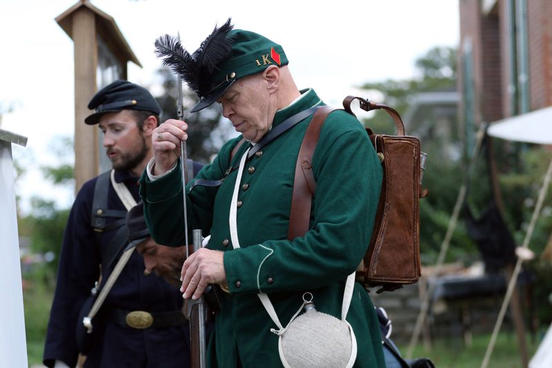 Bruce Hajost loads his rifle during a Civil War encampment by the William McKinley Camp 21 reenactors on Sept. 27, 2025, in Rushville, Ohio.