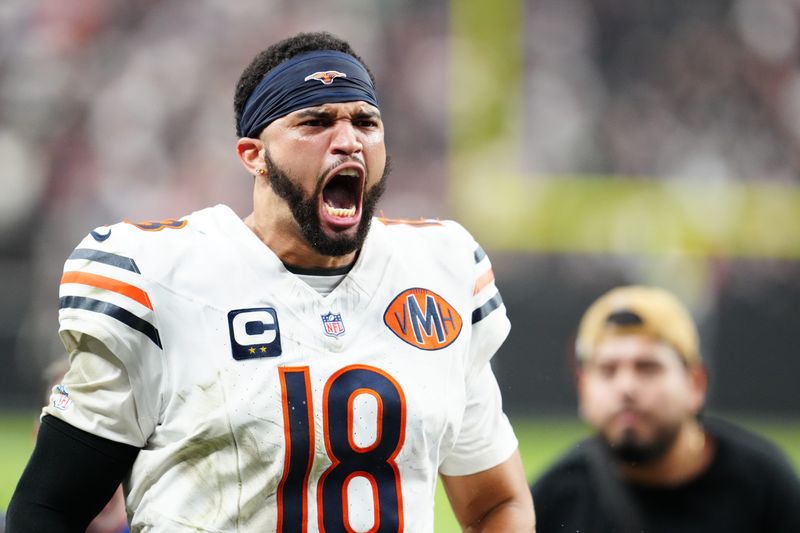 Sep 28, 2025; Paradise, Nevada, USA; Chicago Bears quarterback Caleb Williams (18) celebrates after the game against the Las Vegas Raiders at Allegiant Stadium. Mandatory Credit: Stephen R. Sylvanie-Imagn Images