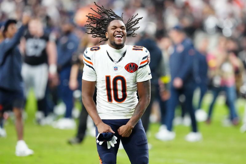Sep 28, 2025; Paradise, Nevada, USA; Chicago Bears wide receiver Luther Burden III (10) celebrates after the game against the Las Vegas Raiders at Allegiant Stadium. Mandatory Credit: Stephen R. Sylvanie-Imagn Images