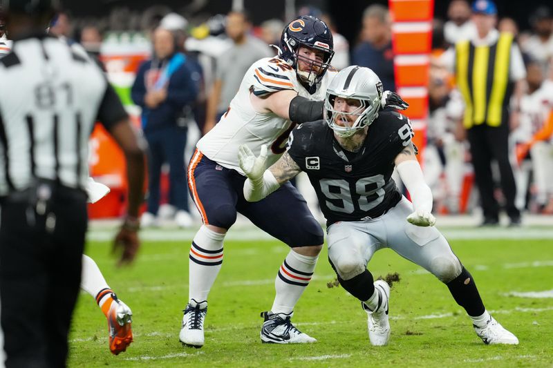Sep 28, 2025; Paradise, Nevada, USA; Chicago Bears guard Joe Thuney (62) attempts to stop Las Vegas Raiders defensive end Maxx Crosby (98) during the second half at Allegiant Stadium. Mandatory Credit: Stephen R. Sylvanie-Imagn Images
