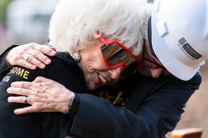 Maybelle Blair, former All-American Girls Professional Baseball League player, and Kat Williams, CEO of the International Women's Baseball Center, hug after the groundbreaking of Beyer Stadium at Maybelle Blair Park on Oct. 6, 2025, in south Rockford.