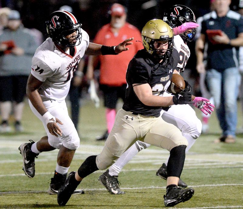 Sacred Heart-Griffin's Mikey Groesch runs the ball against Springfield High at Ken Leonard Field on Friday, October, 10, 2025.