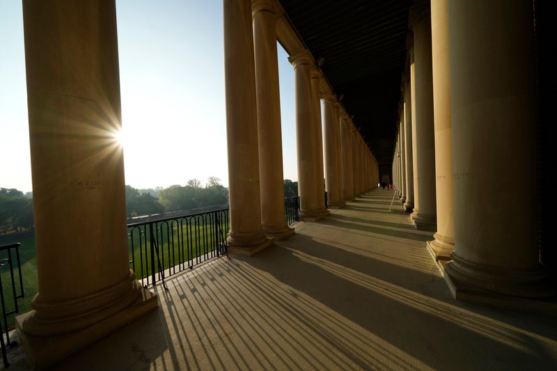 The sun shines through the colonnades at Gies Memorial Stadium in Champaign prior to the NCAA football game between the Illinois Fighting Illini and the Ohio State Buckeyes on Oct. 11, 2025.