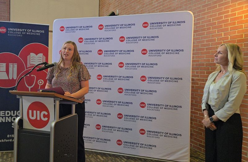 Cheyenne Carr, a student at the University of Illinois College of Medicine Rockford, (left) speaks Oct. 13, 2025, after being named one of two future doctors chosen for a program designed to address a shortage of primary care physicians in the Rockford area. Dr. Rhonda Verzal, director of the college's Integrated Family Medicine Residency Program, looks on.