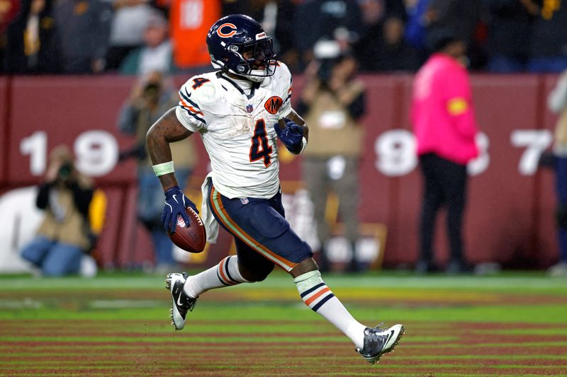 Oct 13, 2025; Landover, Maryland, USA; Chicago Bears running back D'Andre Swift (4) scores a touchdown during the fourth quarter against the Washington Commanders at Northwest Stadium. Mandatory Credit: Peter Casey-Imagn Images