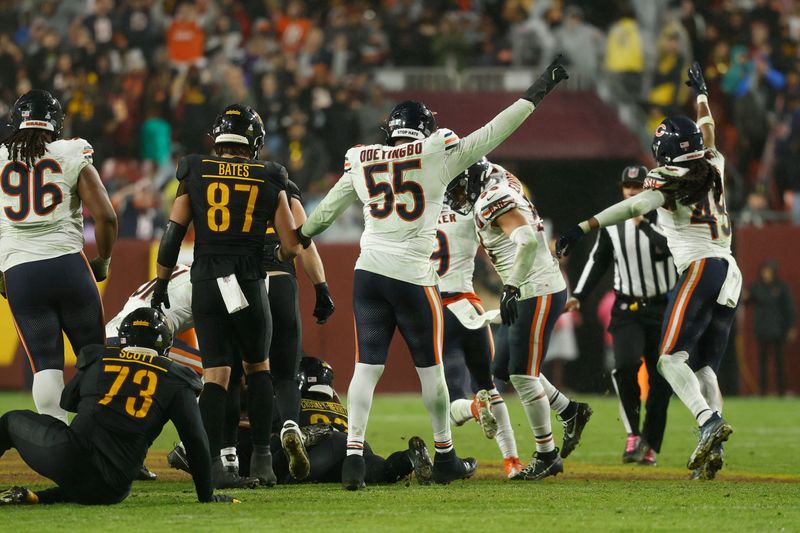 Oct 13, 2025; Landover, Maryland, USA; Chicago Bears players celebrate after recovering a fumble by Washington Commanders running back Jacory Croskey-Merritt (22) during the fourth quarter at Northwest Stadium. Mandatory Credit: Geoff Burke-Imagn Images