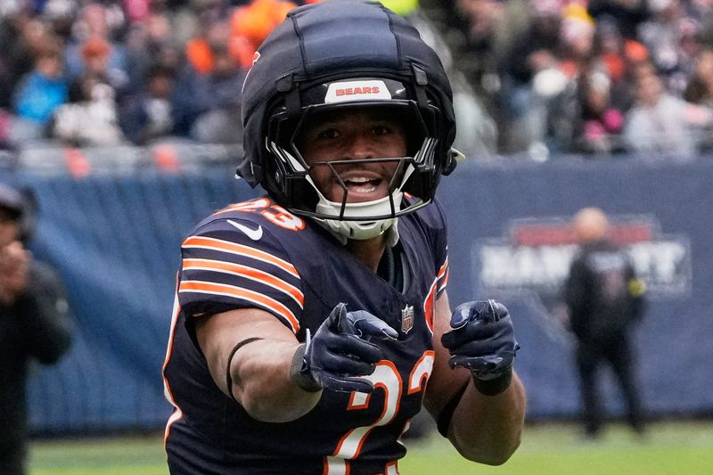 Oct 19, 2025; Chicago, Illinois, USA; Chicago Bears running back Roschon Johnson (23) reacts after running for a first down against the New Orleans Saints during the first half at Soldier Field. Mandatory Credit: David Banks-Imagn Images