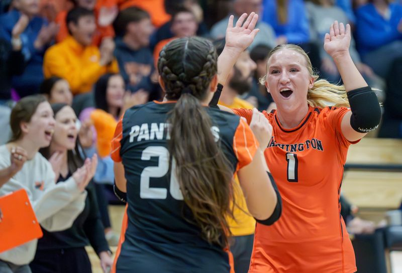 Washington’s Kami Barth (1) celebrates with teammate Jenna Spiezio during the Class 3A volleyball regional title match Thursday, Oct. 30, 2025 at Washington Community High School. The Panthers upset the Rockets in straight sets 25-23, 25-23.