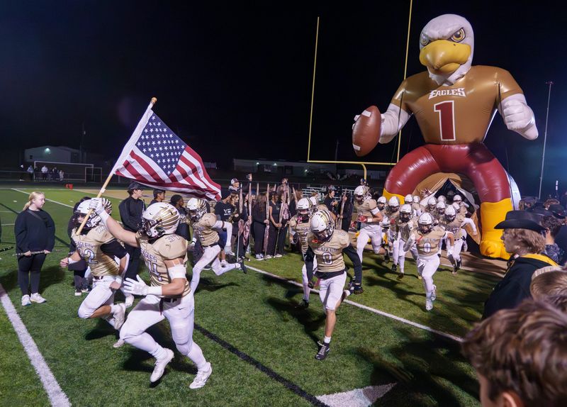 The Dunlap Eagles take the field to face Pekin in their Class 6A high school football playoff game Friday, Oct. 31, 2025 in Dunlap. The Eagles advanced to the second round with a 49-21 victory.