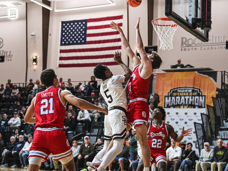 Bradley Braves guard Alex Huibregtse and forward A.J. Smith battle under the basket with St. Bonaventure's Dasonte Bowen during Bradley's 69-63 loss in the Field of 68 Opening Day Marathon at Rich Hill, S.C. on Monday, Nov. 3, 2025.