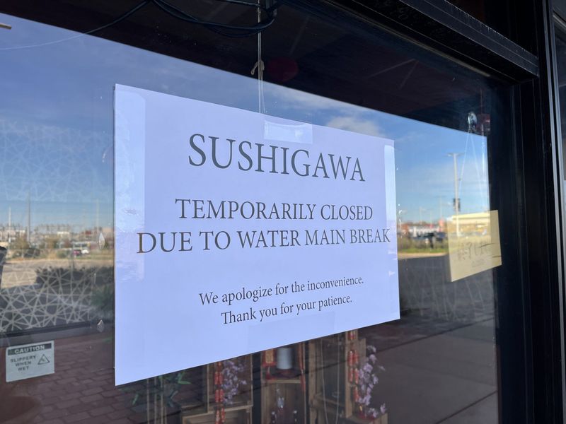 A temporarily closed sign is posted Friday, Nov. 7, on the door of Sushigawa at 2601 W. Lake Ave.