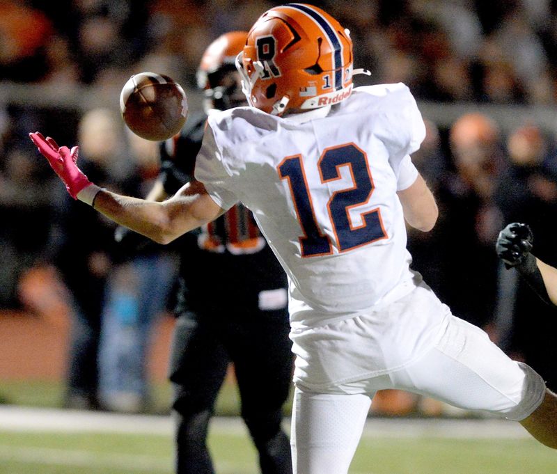 Rochester's Nate Swaney catches a ball in the end zone for a touchdown during the game against Waterloo Friday, Nov. 7, 2025.