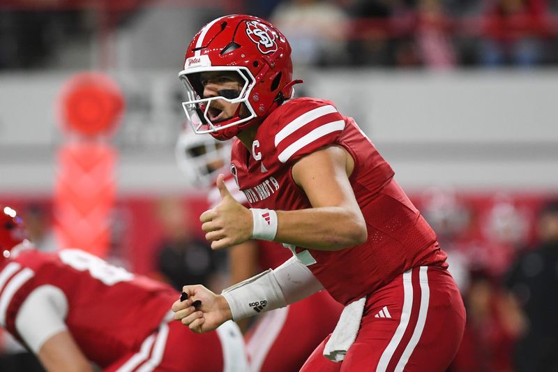 South Dakota Coyotes quarterback Aidan Bouman (2) yells out to his team before starting the play during the Interstate Series game on Saturday, Nov. 8, 2025, at Dakota Dome in Vermillion, South Dakota.