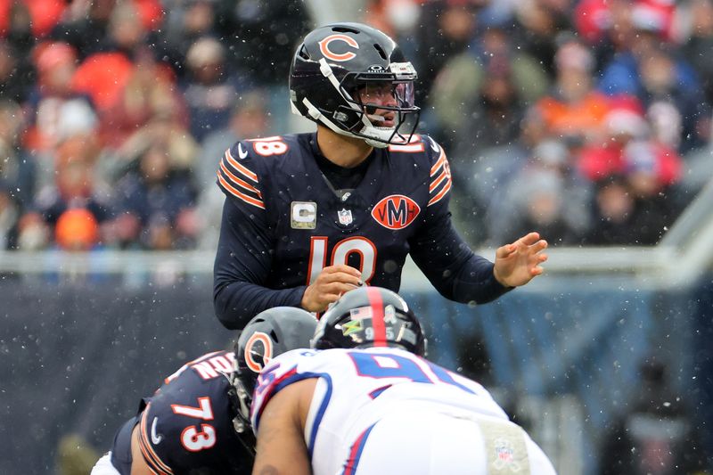 Nov 9, 2025; Chicago, Illinois, USA; Chicago Bears quarterback Caleb Williams (18) reacts against the New York Giants during the first half at Soldier Field. Mandatory Credit: Mike Dinovo-Imagn Images