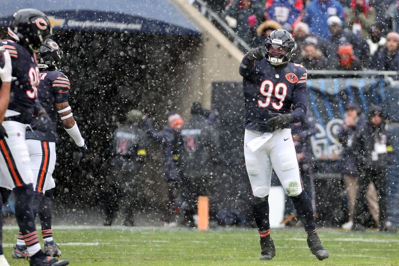 Nov 9, 2025; Chicago, Illinois, USA; Chicago Bears defensive tackle Gervon Dexter Sr. (99) reacts after a tackle against the New York Giants during the first half at Soldier Field. Mandatory Credit: Mike Dinovo-Imagn Images