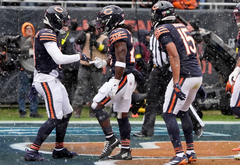 Nov 9, 2025; Chicago, Illinois, USA; Chicago Bears running back Kyle Monangai (25) celebrates with teammates after a touchdown during the first half against the New York Giants at Soldier Field. Mandatory Credit: David Banks-Imagn Images